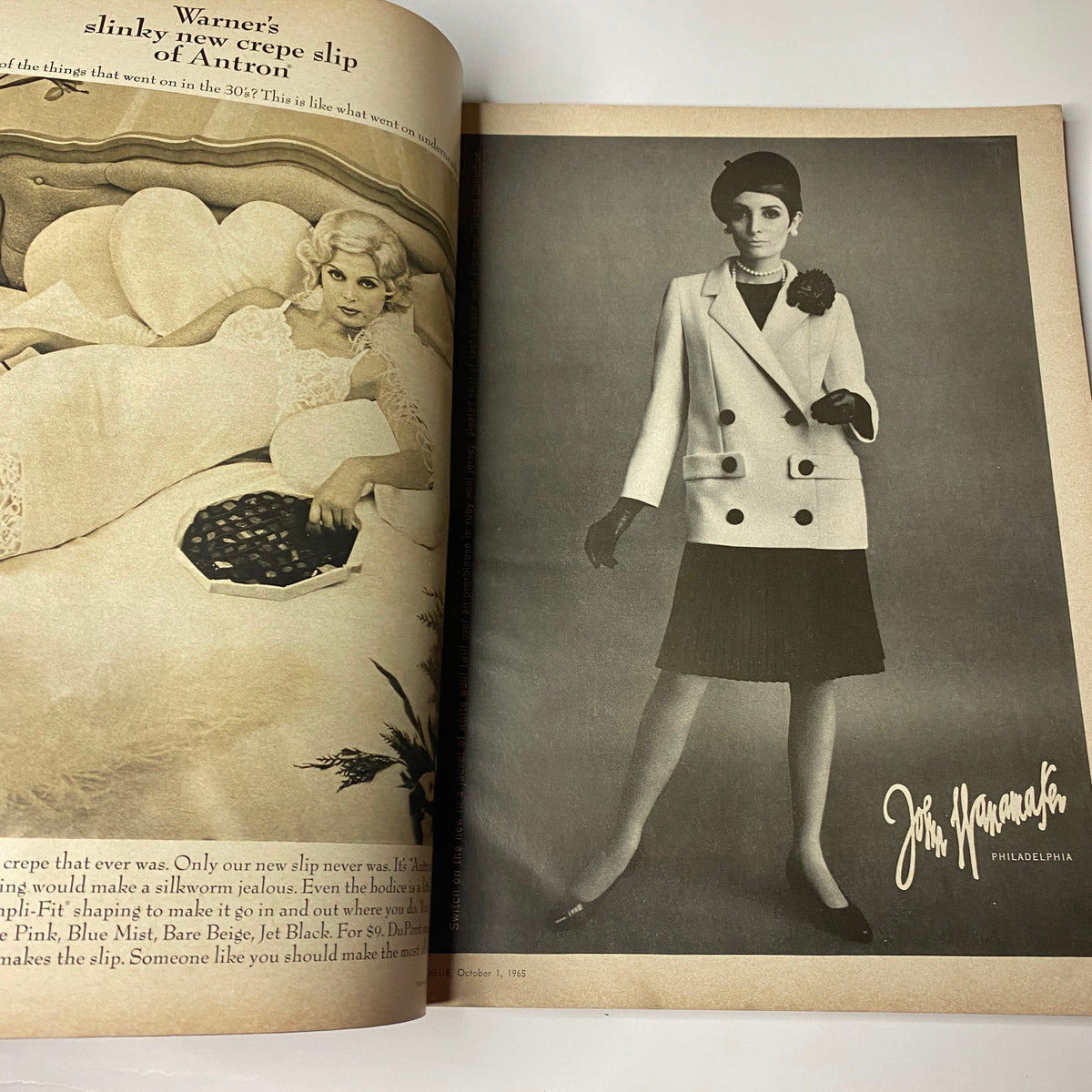 Advertisement for Warner's new crepe slip in Vogue Magazine October 1, 1965, showcasing vintage clothing and styling by a model, enhancing the era's fashion.