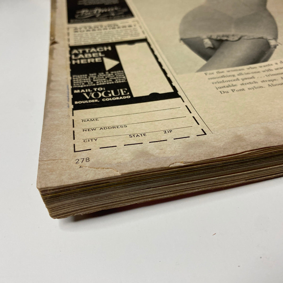 Back cover section of Vogue Magazine October 1, 1965 showing worn edges and vintage label details, illustrating the magazine's antique charm and wear.