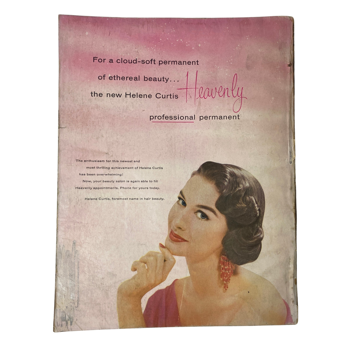 Advertisement for Helene Curtis Heavenly professional permanent in Harper's Bazaar Magazine May 1955, featuring a glamorous model and promoting beauty products from the era.