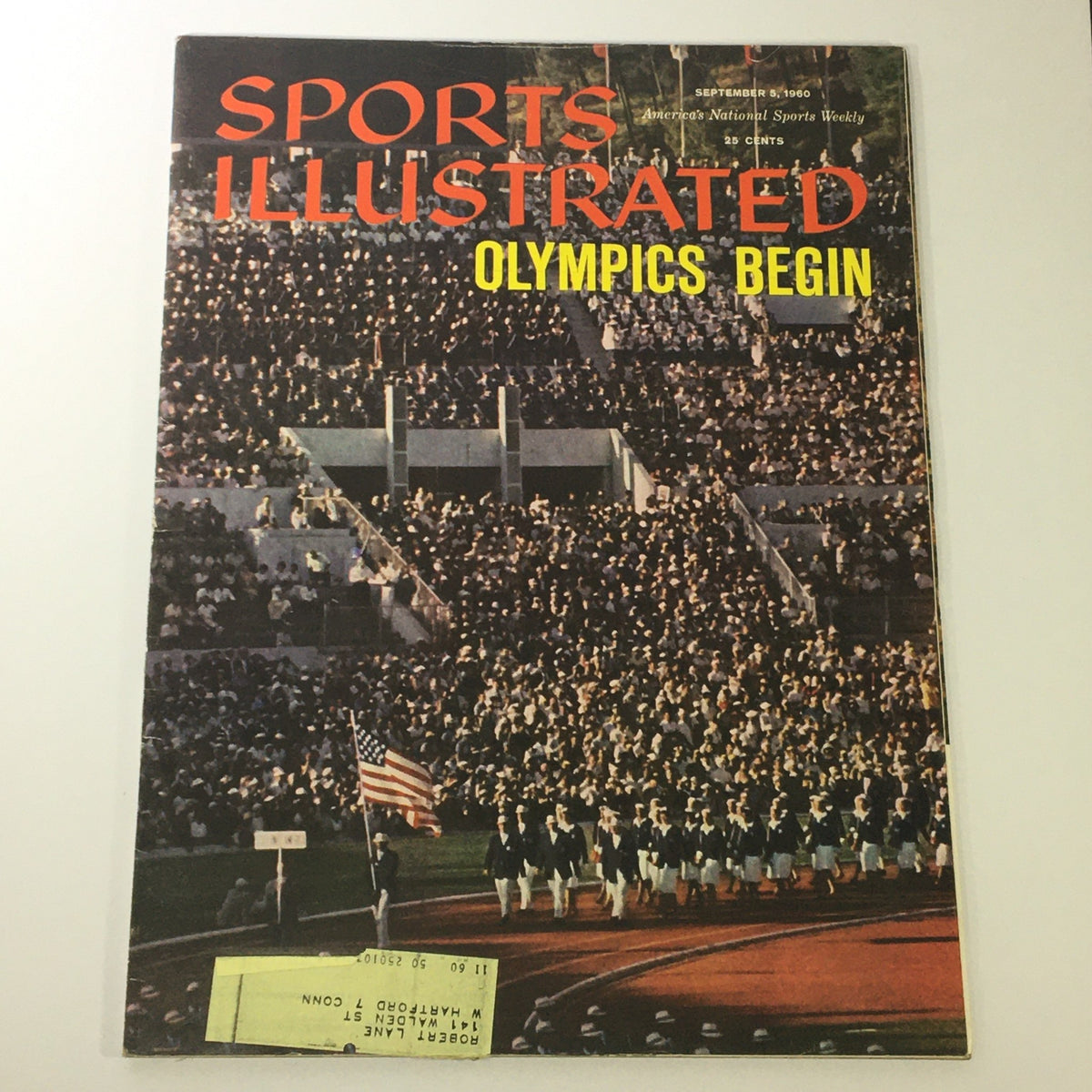 Vintage Sports Illustrated Magazine featuring the article 'Olympics Begin' - September 5, 1960, showcasing an iconic moment from the opening ceremony of the Rome Olympics, with a large crowd, athletes marching, and the American flag.