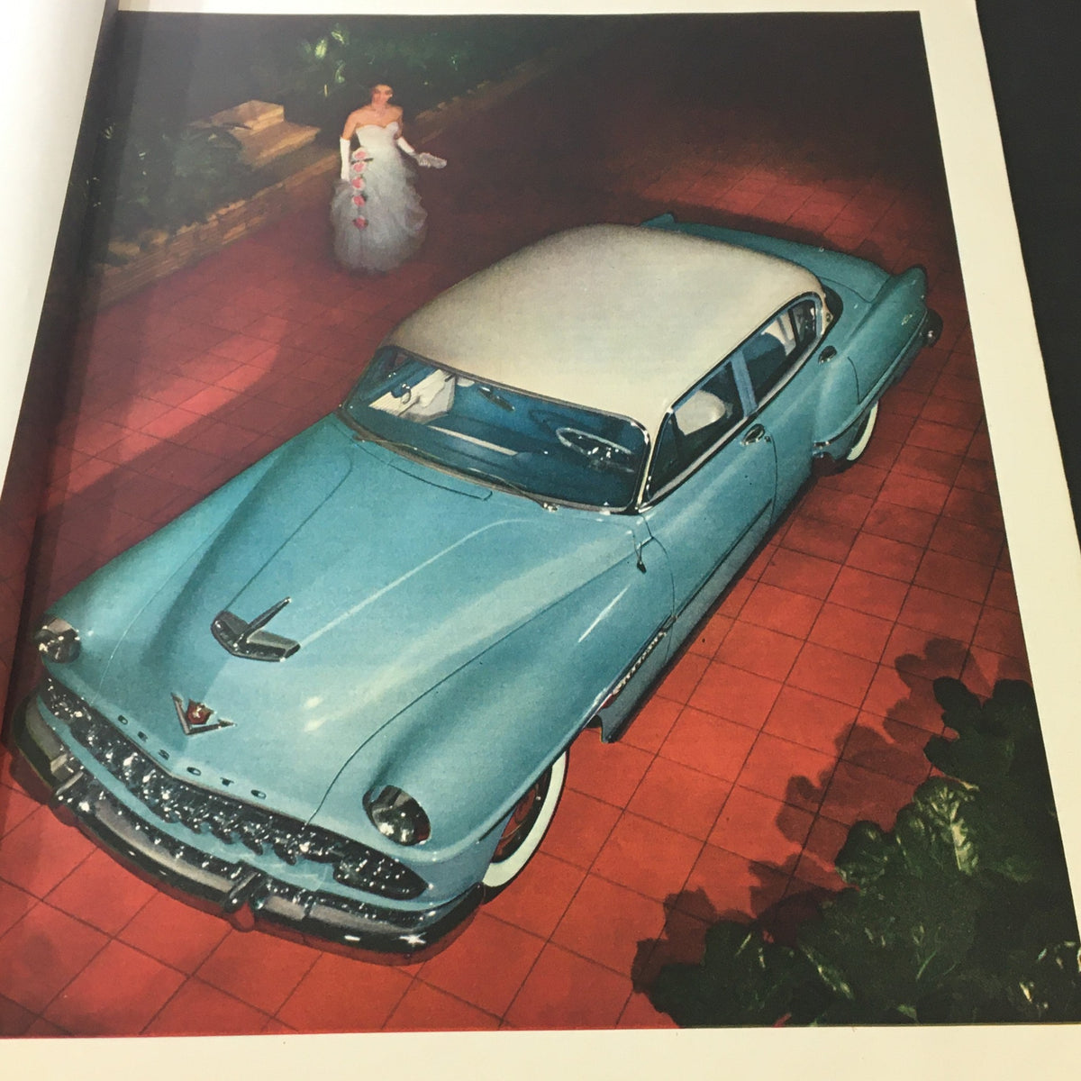 Artistic portrayal of a classic blue 1950s car with a woman in an evening gown from VTG The Saturday Evening Post April 10 1951.