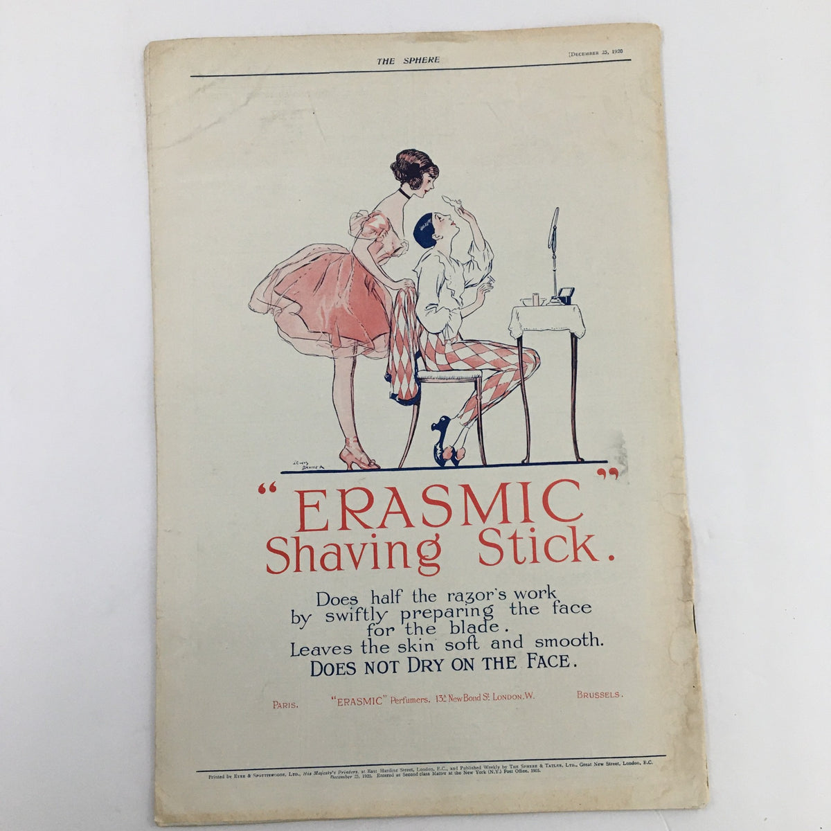 The Sphere Newspaper December 25 1920 advertisement for 'ERASMIC' Shaving Stick featuring a vintage illustration of a man being shaved by a woman.