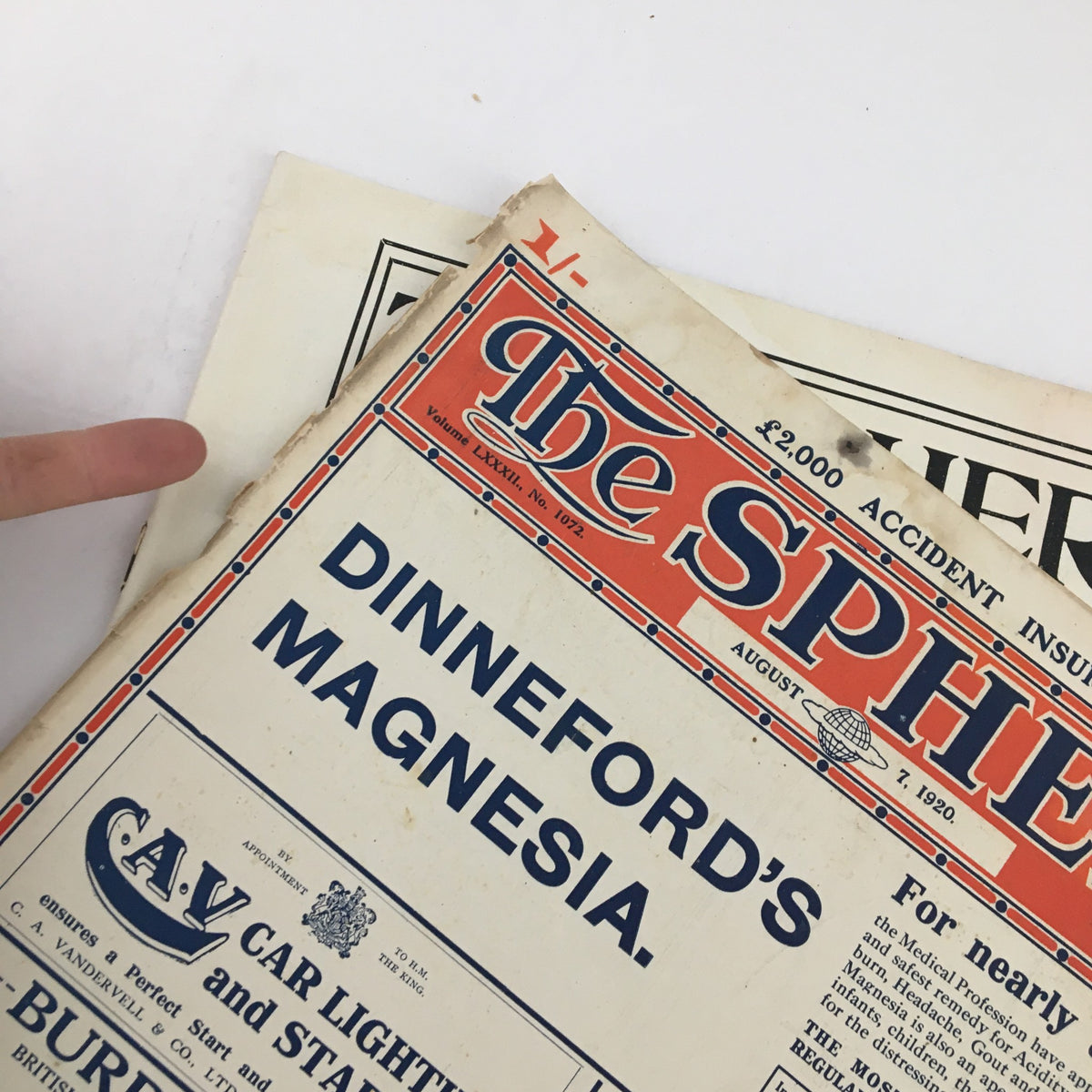 Close-up view of The Sphere Newspaper August 7 1920 showing the advertisement for Dinneford's Magnesia, highlighting vintage design elements.