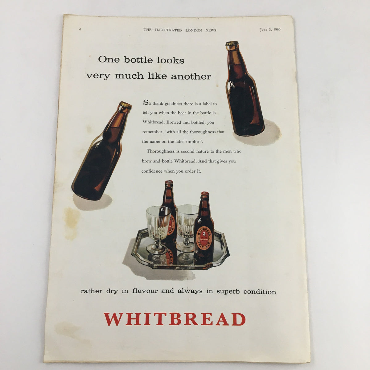 A page from The Illustrated London News, July 2, 1960, featuring an advertisement for Whitbread beer, showcasing two bottles and glasses on a tray with informative text about the brand.