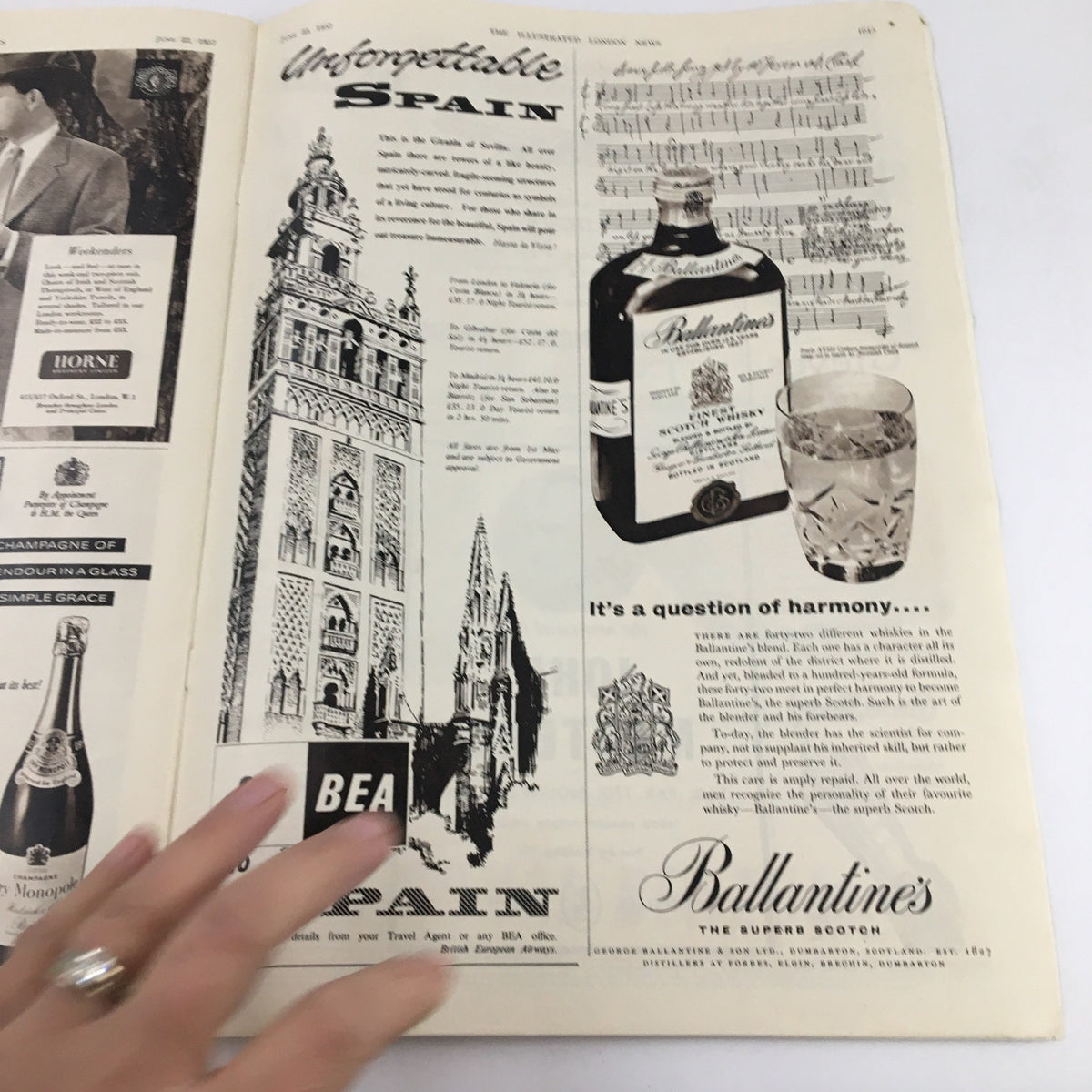 Advertisement and travel feature titled 'Unforgettable Spain' from The Illustrated London News, June 22, 1957, showcasing Spanish architecture and Ballantine's whiskey.
