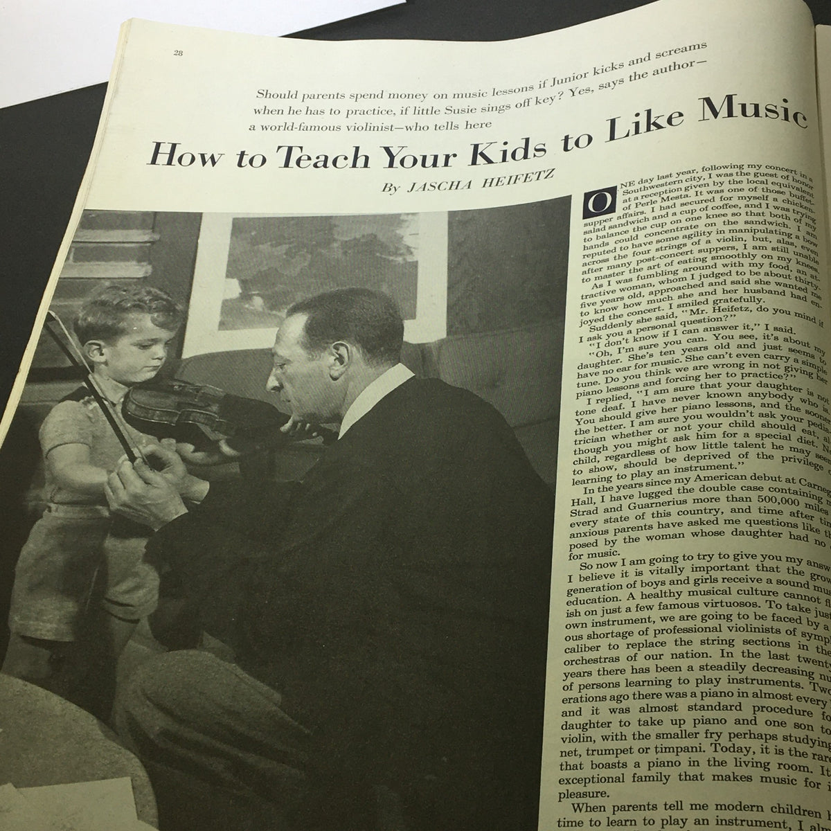 Article titled 'How to Teach Your Kids to Like Music' from The Saturday Evening Post, March 7, 1953, showing a musician demonstrating violin technique to a child, emphasizing music education.