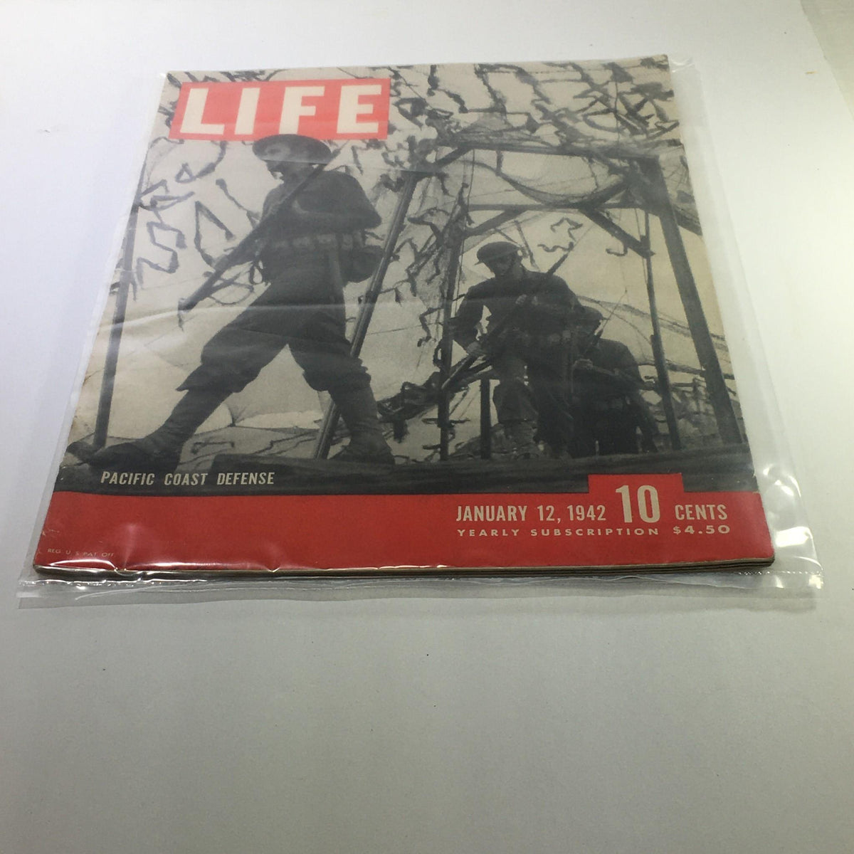 Cover of Life Magazine: January 12, 1942 - Pacific Coast Defense featuring soldiers, showcasing military themes and historical context from World War II.