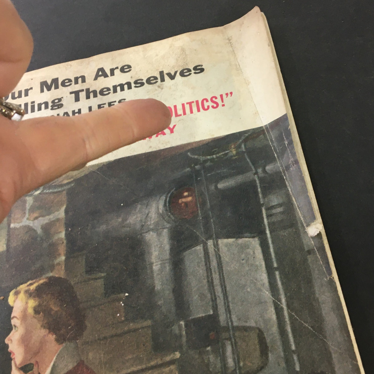 Image showing a hand pointed at the title on the vintage magazine cover of The Saturday Evening Post from January 28, 1956, titled 'Keep Army Out of Politics'.