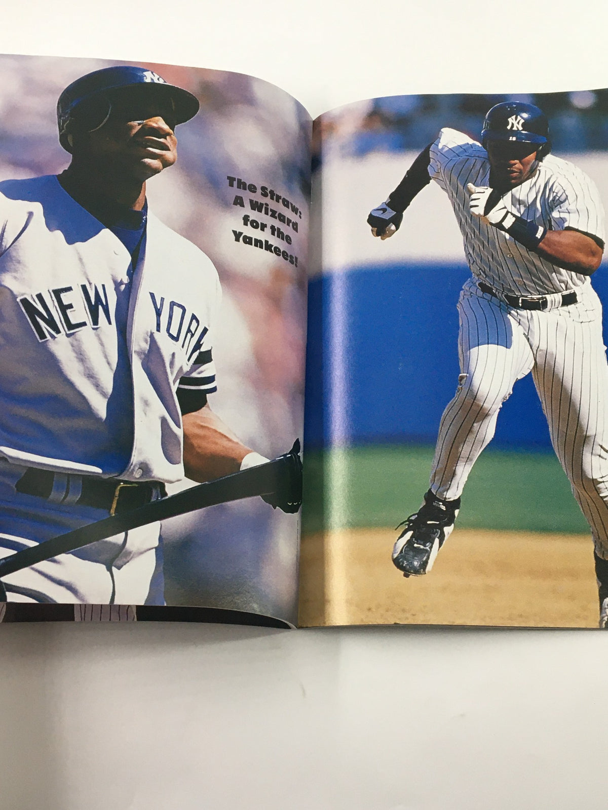 Profile view of New York Yankees players in action, featured in the 1996 Gold Collectors Series Magazine celebrating Derek Jeter and key team members.