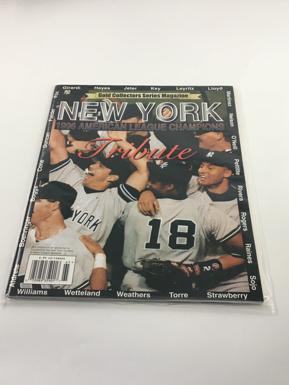 1996 Gold Collectors Series Magazine featuring Derek Jeter and Gerald Williams celebrating the New York Yankees' American League Championship. Vintage collectible sports magazine highlighting the iconic moments of baseball in the late 90s.
