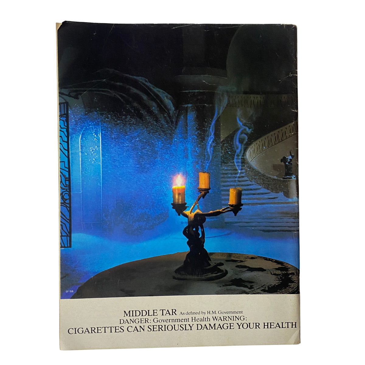 Cover of Car Magazine UK February 1985, showcasing a dramatic artwork and featuring a government health warning about the dangers of smoking, alongside the title of the magazine.