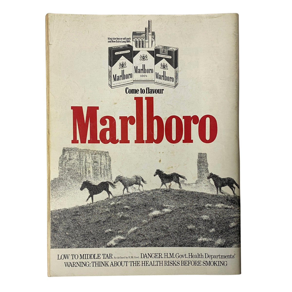 Advertisement page from Car Magazine February 1983 featuring Marlboro branding, with a visual depicting horses against a scenic background.