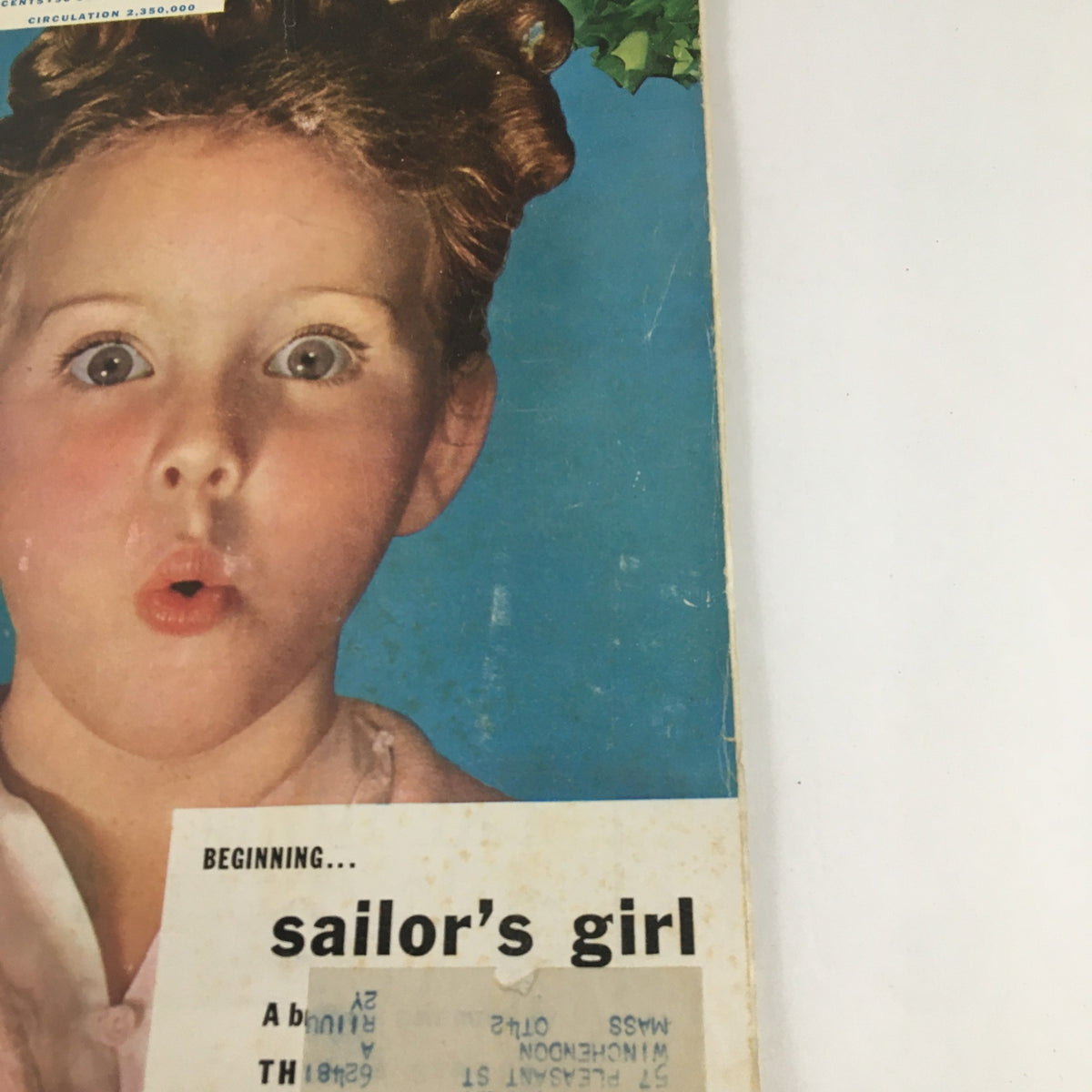 Close-up of the cover of The American Magazine January 1942 with a shocked expression from a girl and the headline 'sailor's girl', highlighting classic American magazine art.