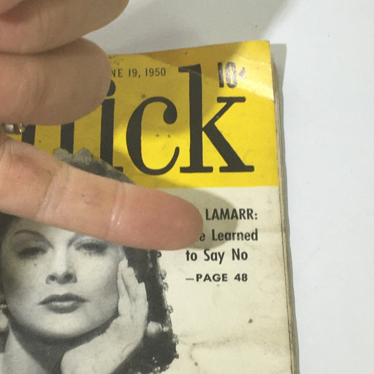 Close-up view of the VTG Quick News Weekly magazine dated June 19, 1950, with Hedy Lamarr on the cover. The image highlights the magazine's title and an article reference, showing its vintage appeal.