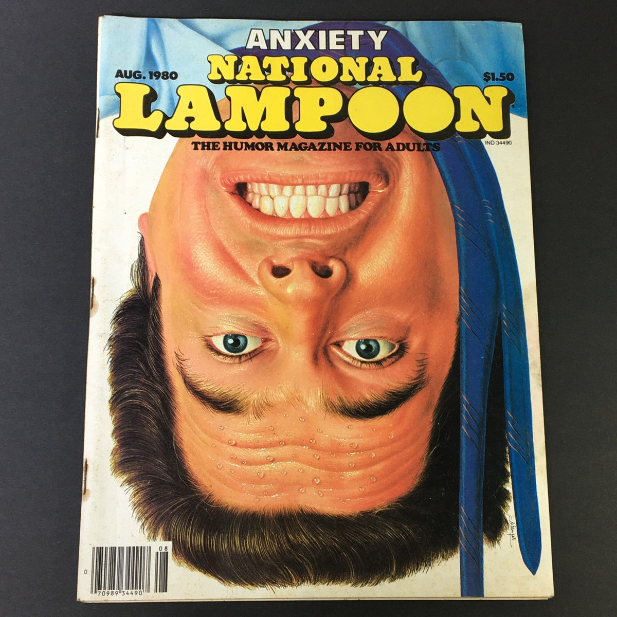 Cover of National Lampoon Magazine August 1980 Anxiety Issue featuring a humorous illustration of a smiling man with prominent facial features, highlighting the comedic style of the magazine.