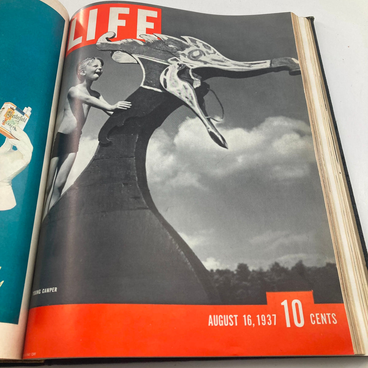 Cover of VTG 1937 Bound Life Magazine from August 16, 1937 featuring a young boy standing on a dragon-shaped water slide, evoking nostalgia and vintage charm.