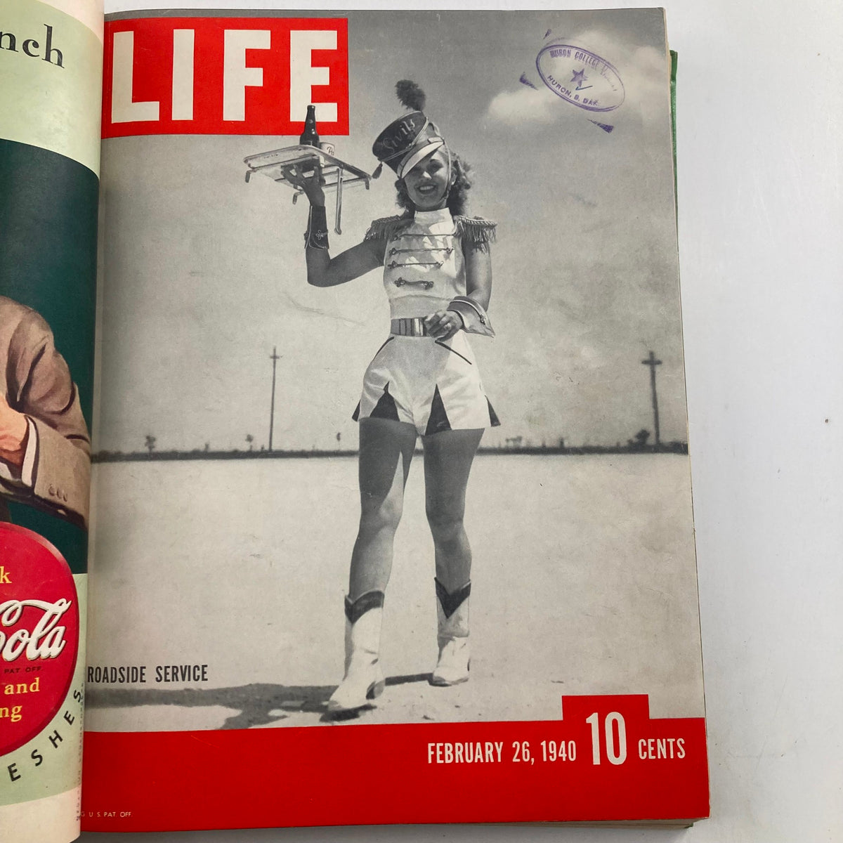 1940 Bound LIFE Magazine cover for February 26 depicting a woman in a marching band outfit, symbolizing roadside service culture of the time.