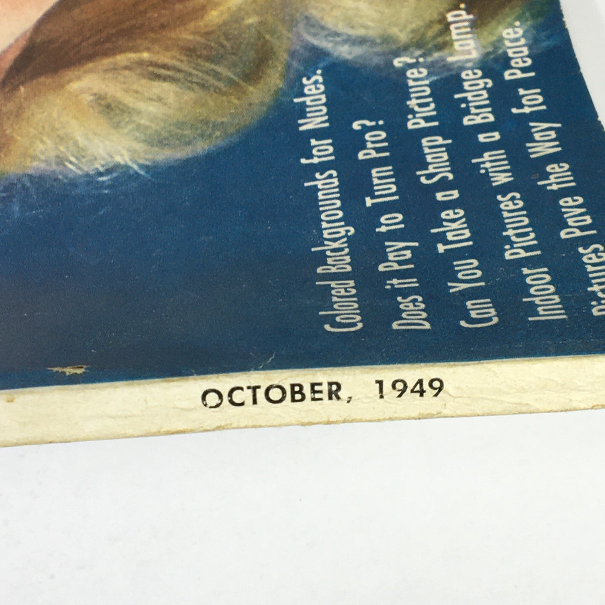A close-up view of the October 1949 date and text from the Modern Photography magazine, emphasizing its vintage authenticity.