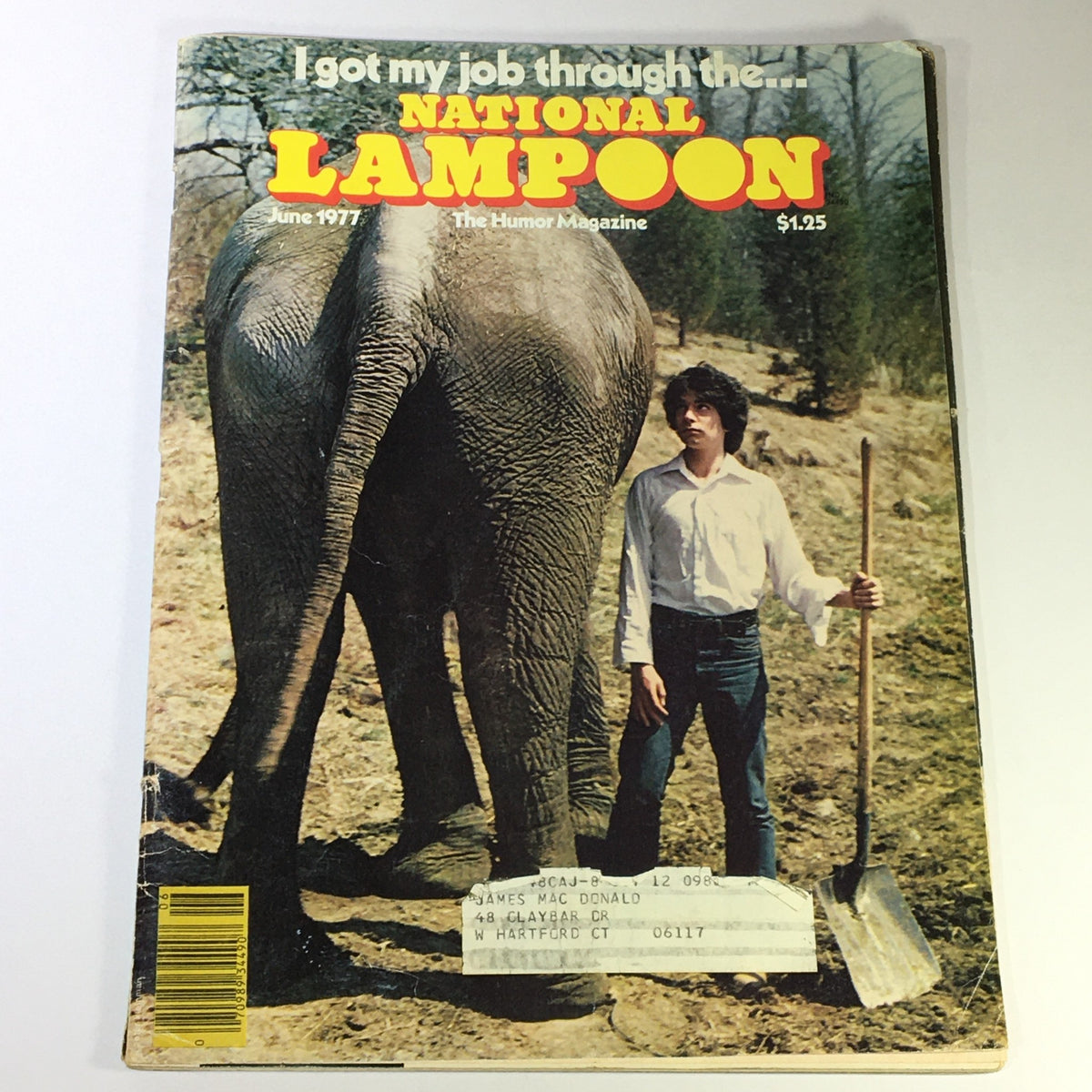 Cover of National Lampoon Magazine June 1977 Vol 1 #87, featuring a humorous illustration with an elephant and a young man in a rural setting.