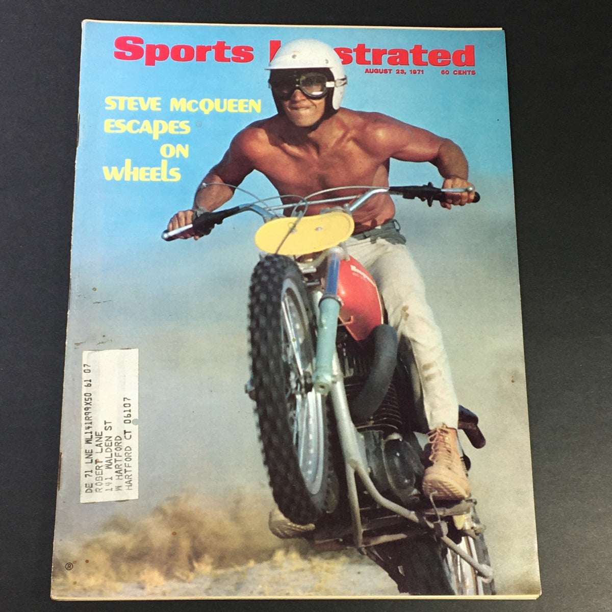 Cover of the VTG Sport Illustrated Magazine from August 23, 1971, featuring Steve McQueen on Wheels, showcasing a dynamic image of McQueen riding a motorcycle.