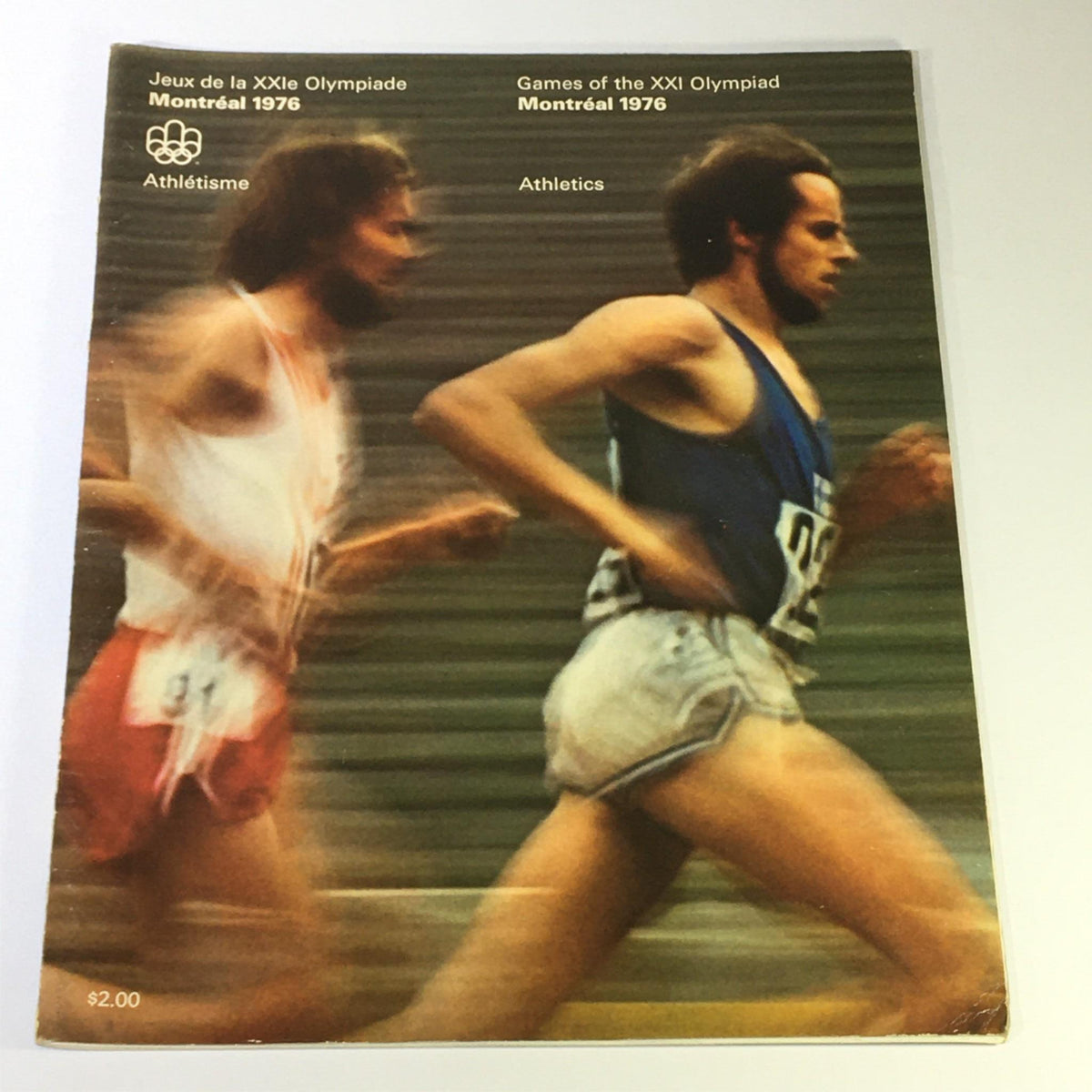 Cover of the VTG Games of the XXI Olympiad Montreal 1976 Athletics Olympic Games Running, featuring two athletes in motion during a running event.