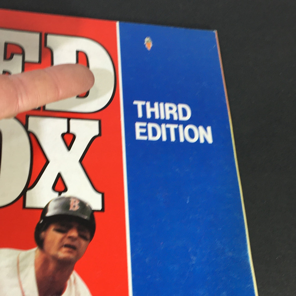 Detailed view of the 1982 Boston Red Sox Scorebook cover, showcasing the title and 'Third Edition' label in bold print.
