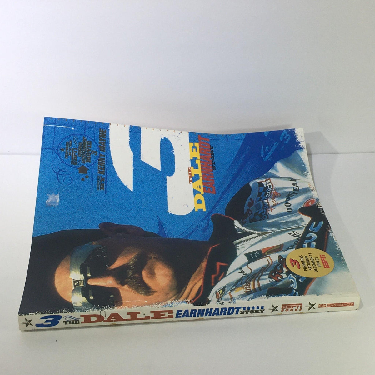 Front cover of '3: The Dale Earnhardt Story ESPN Book by Kenny Mayne' featuring vivid colors and an iconic image of Dale Earnhardt, highlighting its appeal to racing fans.