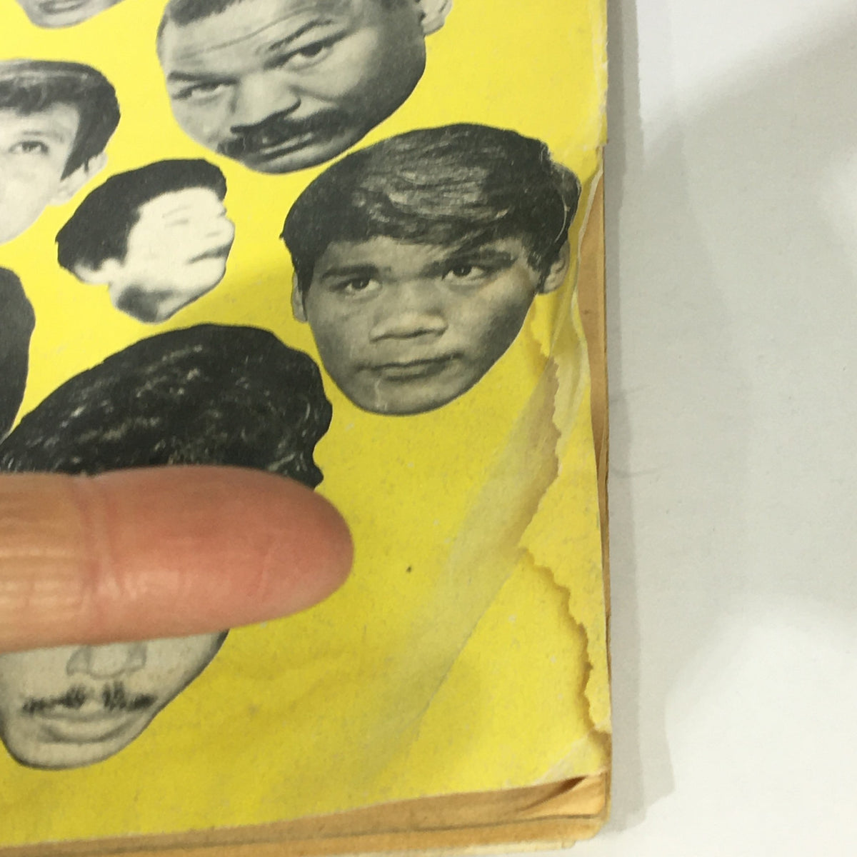 Cover of VTG The Ring Magazine from February 1976 featuring Muhammad Ali and Ken Norton, showcasing illustrations of notable boxing figures against a bright yellow background.