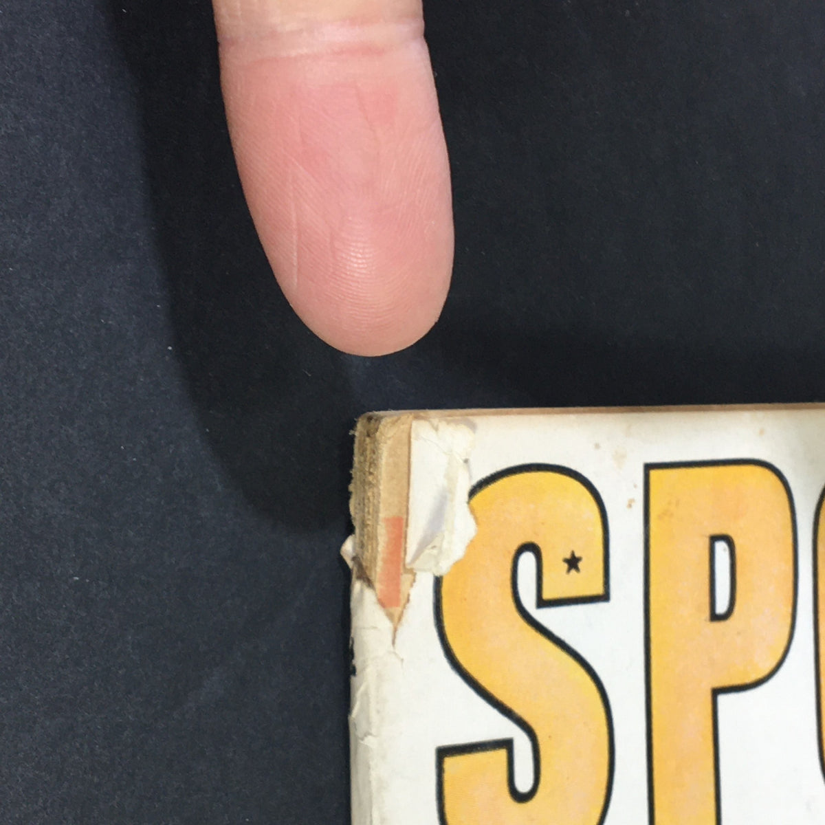 Close-up of the spine of VTG Sport Magazine November 1955 showing wear and tear, ideal for collectors.