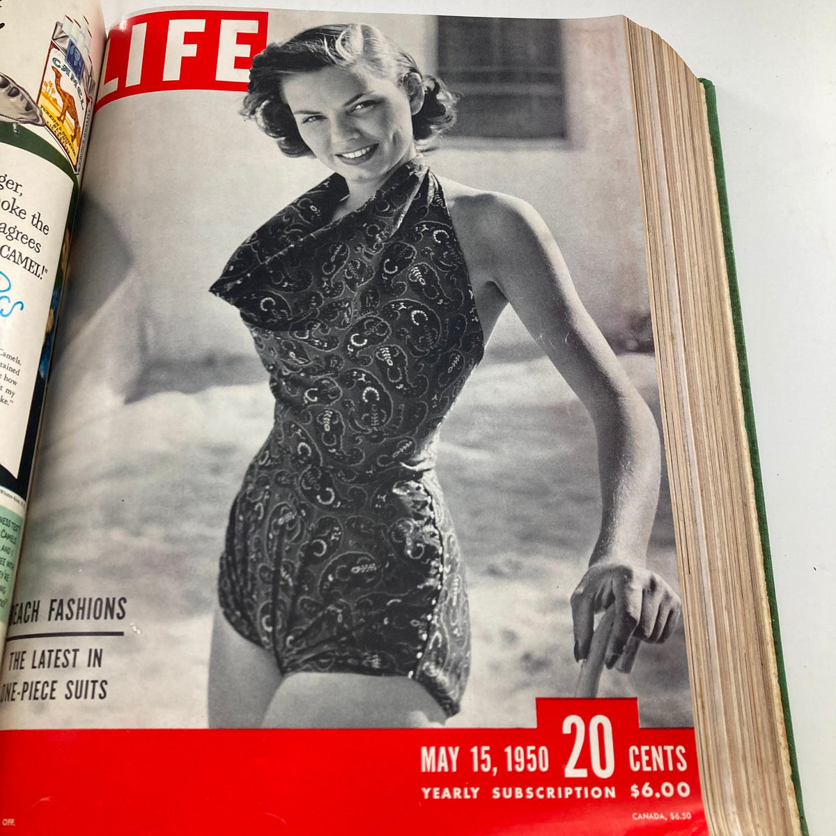Vintage 1950 Bound Life Magazine May 15 issue showcasing the latest in women's beach fashion with a model wearing a stylish one-piece suit.