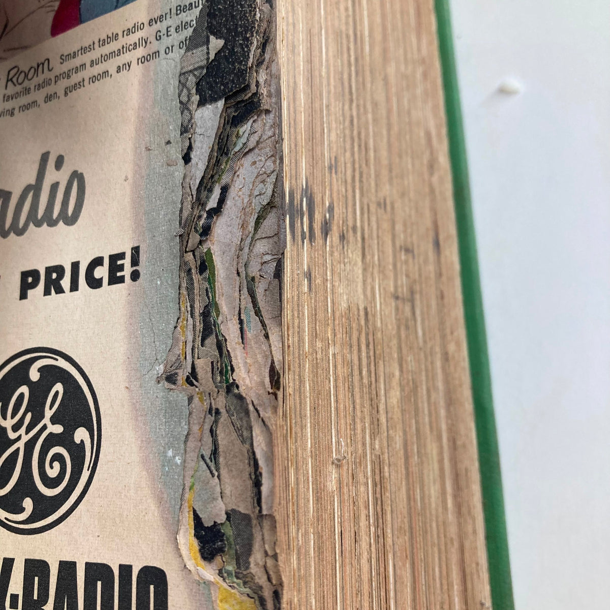 Close-up of the edge of the VTG 1950 Bound Life Magazine collection, showcasing aged paper with wear and tear, reflecting its vintage quality.