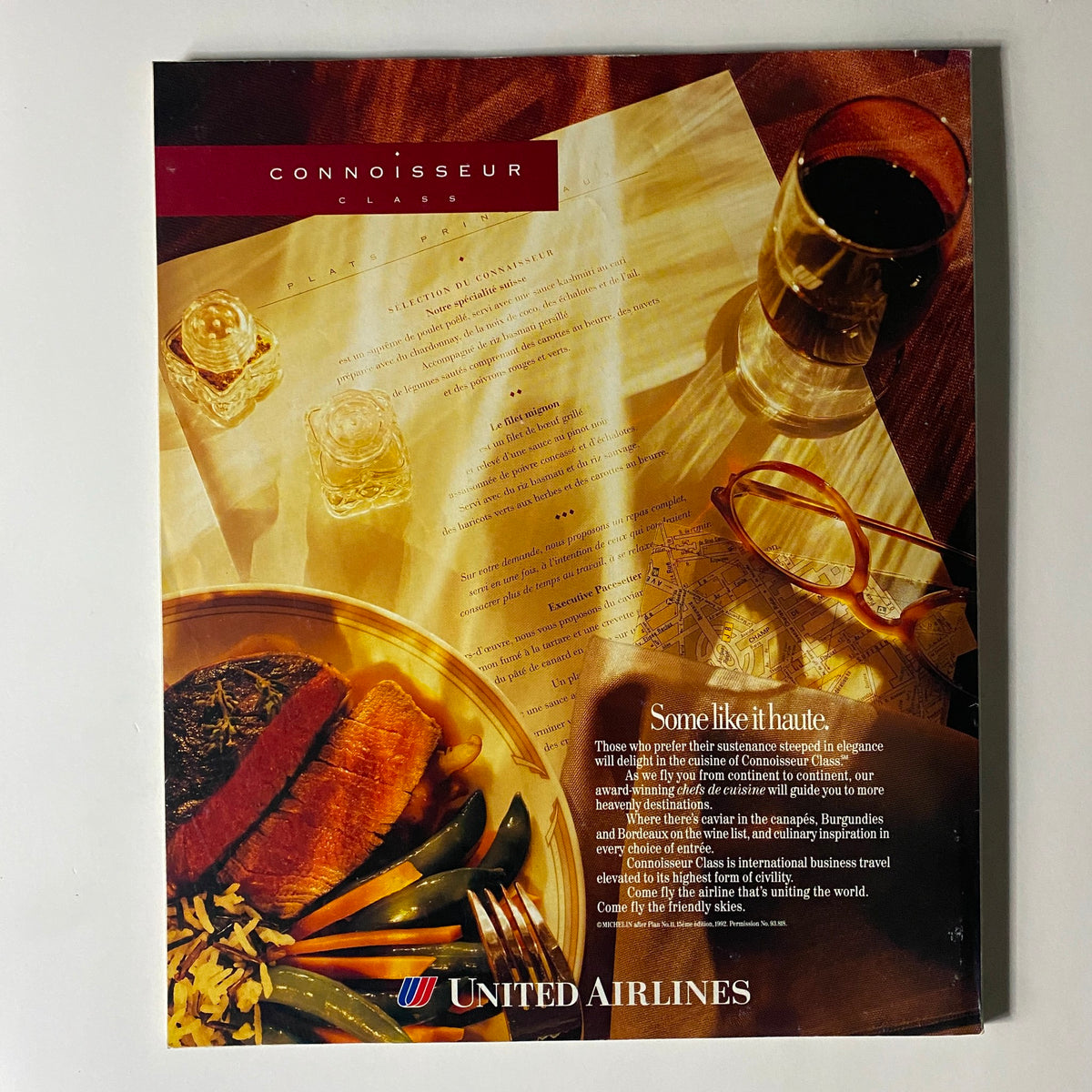 Advertisement from United Airlines promoting Connoisseur Class, featured in Fortune Magazine, October 4, 1993, with a gourmet meal and elegant dining elements.