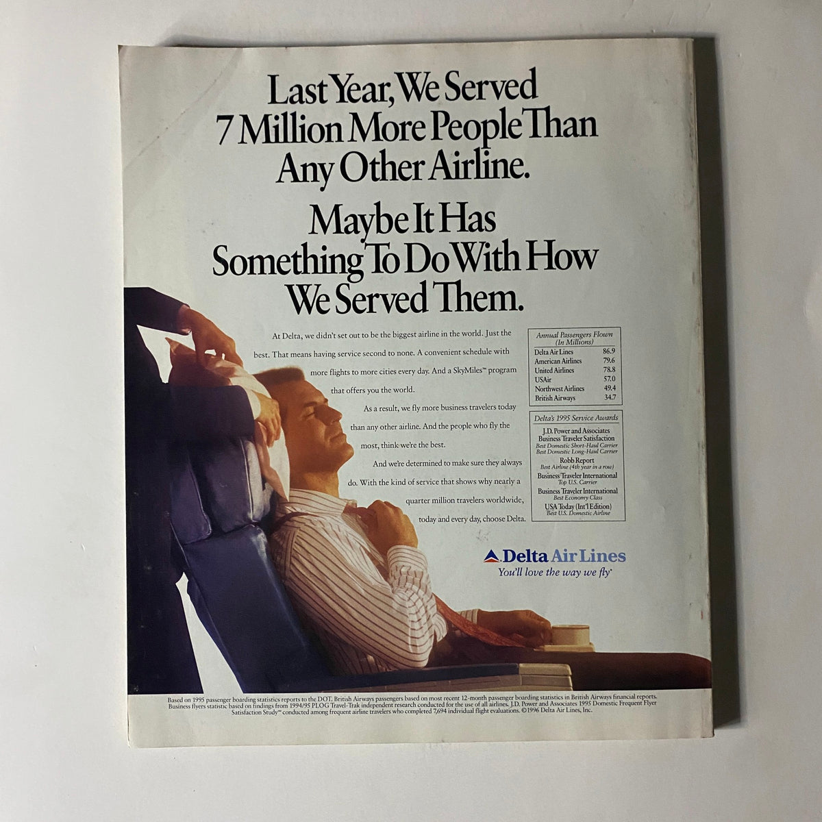 Detail of a vintage advertisement from Fortune Magazine April 15, 1996, featuring Delta Air Lines. The ad highlights Delta's service to 7 million more passengers than any other airline, emphasizing customer service excellence.