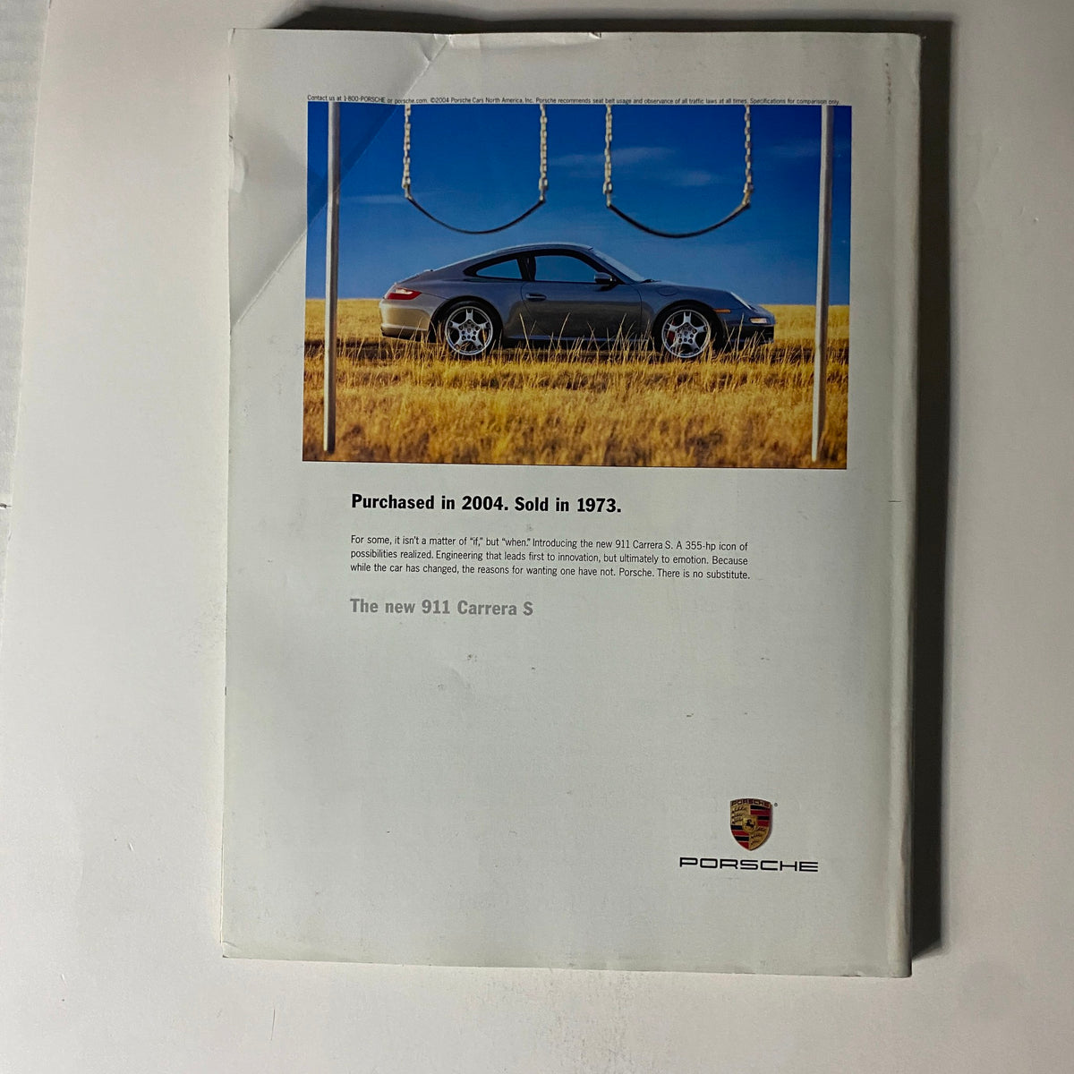 Back cover of Fortune Magazine October 4, 2004 featuring a Porsche advertisement for the new 911 Carrera S, presenting the car's features and date of sale.