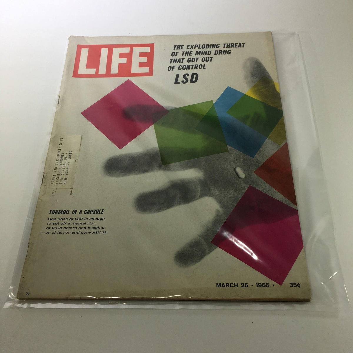 Cover of Life Magazine dated March 25, 1966, titled 'Turmoil in a Capsule: The Mind Drug', featuring a colorful design with shapes and a hand silhouette. This vintage magazine explores the societal impact of LSD and psychotropic substances during the 1960s.