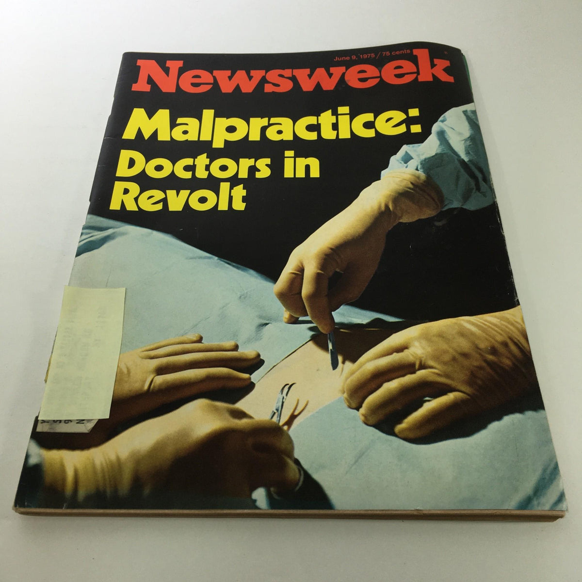 Cover of the vintage Newsweek Magazine dated June 9, 1975, featuring the title 'Malpractice: Doctors in Revolt'. The image shows a surgical scene with doctors' hands and surgical tools, highlighting the discussion on medical malpractice.