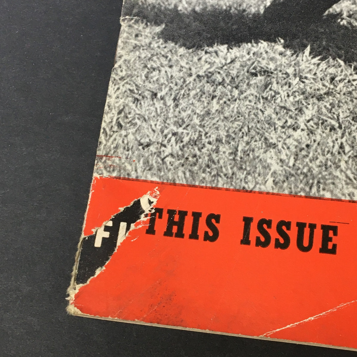 Close-up of the cover detail of VTG Home Movies Magazine August 1945, focusing on the torn edge and text indicating features of the issue.