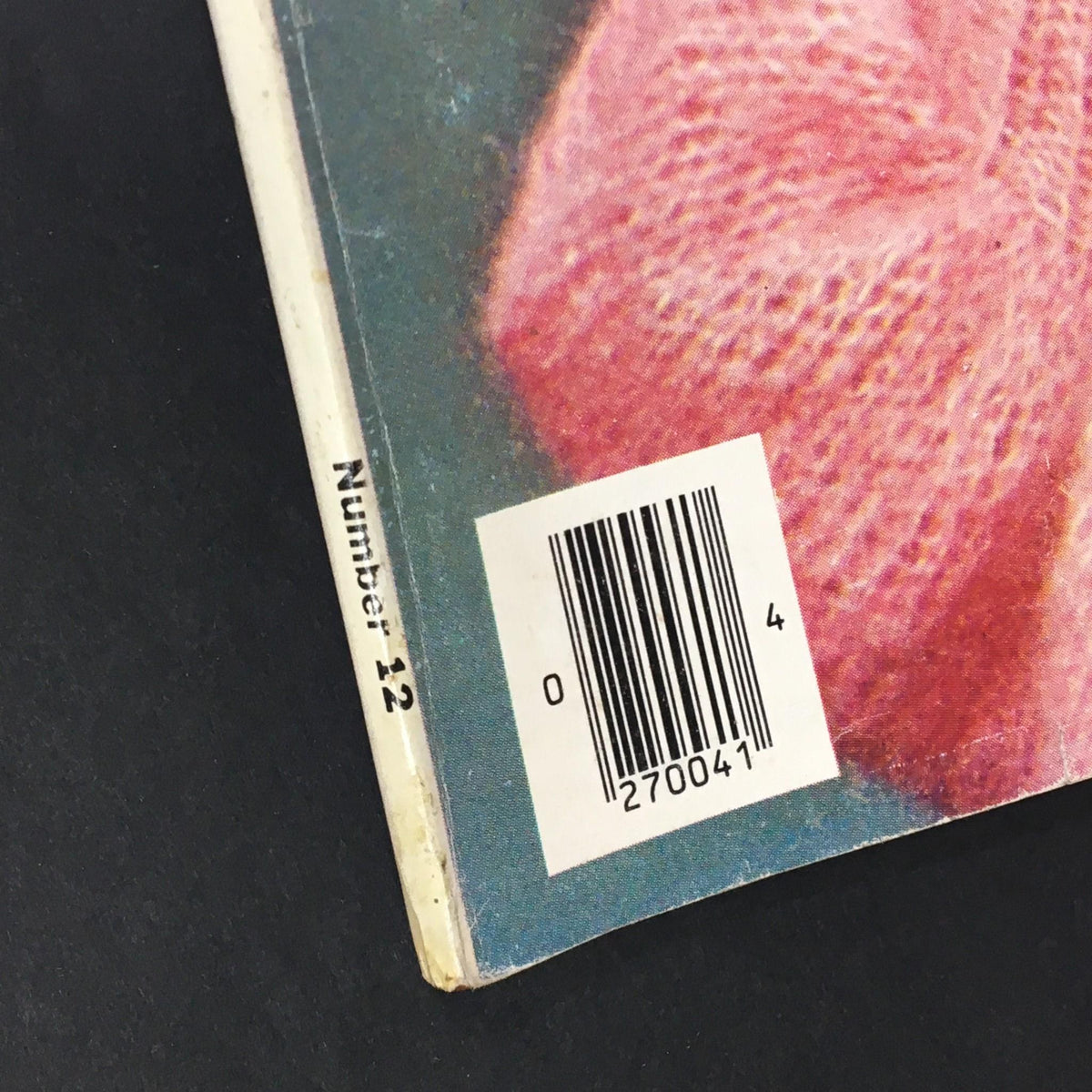Close-up of the side of the VTG Woman's Day 1972 Number 12 magazine, displaying the 'Number 12' label and barcode, emphasizing its vintage publication details.
