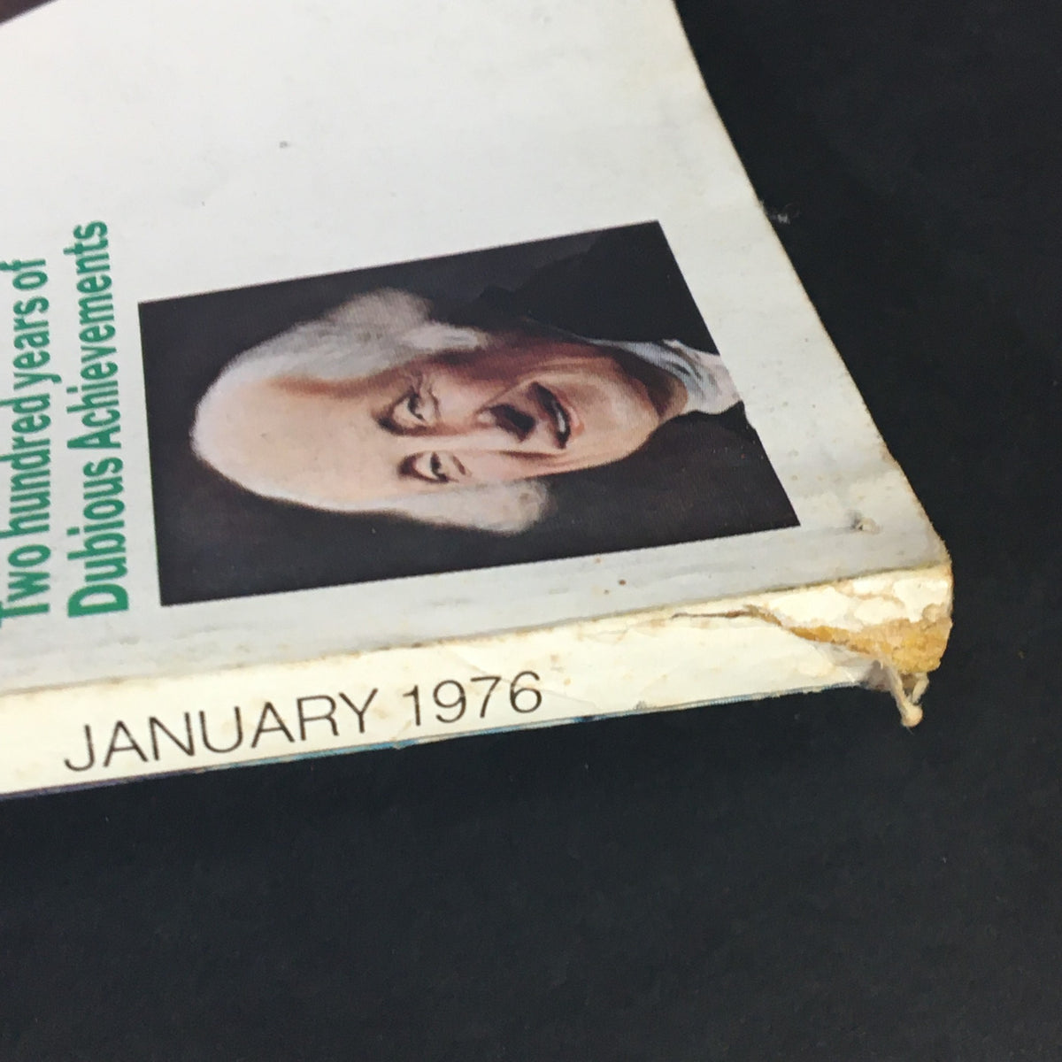 Side view of VTG Esquire Magazine January 1976 showcasing the magazine title and the publication date, along with an image related to the article on Dubious Achievements.