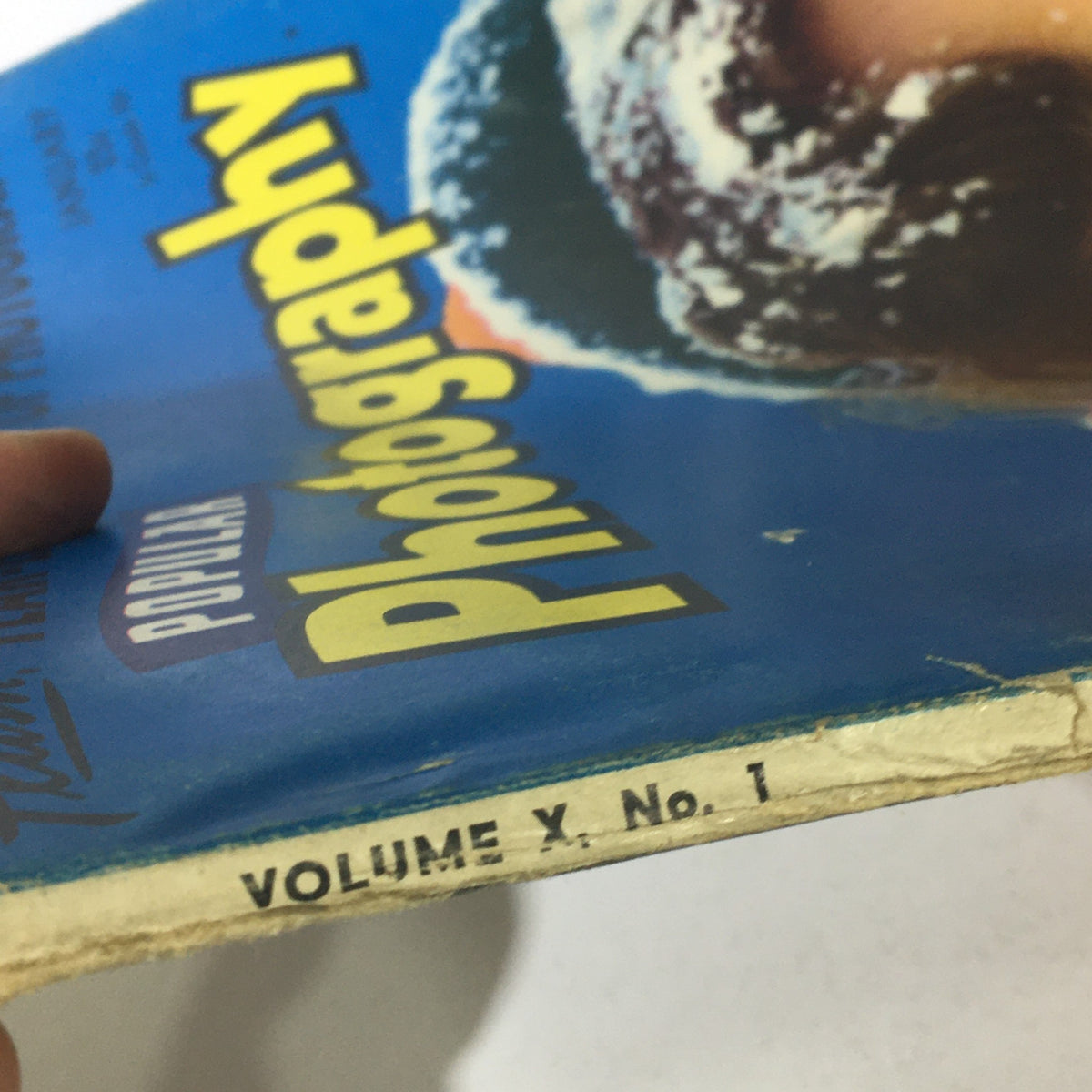 Spine detail of Popular Photography Magazine January 1942 Vol X #1 showing 'VOLUME X. NO. 1' marking for authenticity.
