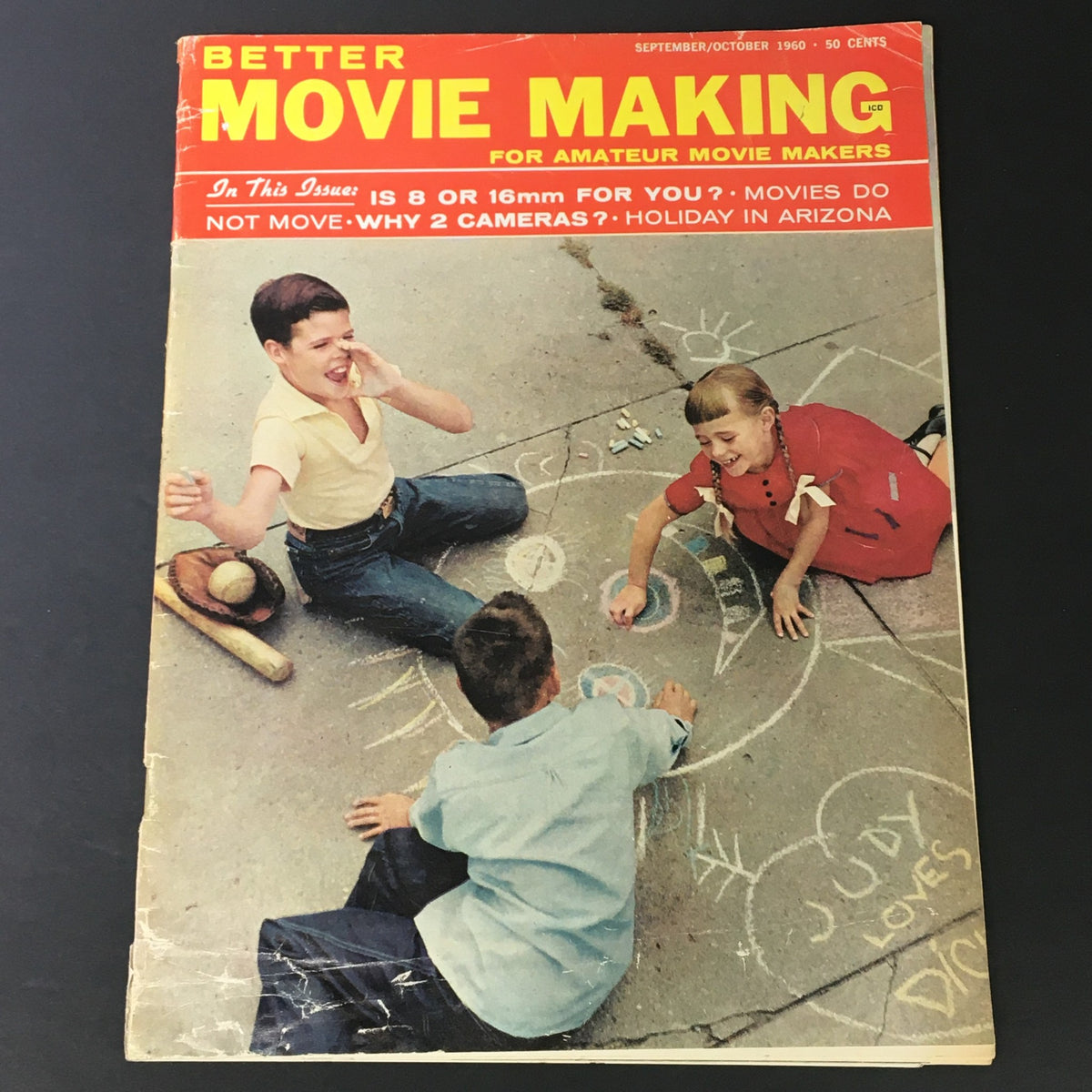 Cover of VTG Better Movie Making magazine from September-October 1960 featuring children playing on a sidewalk with chalk drawings, depicting a nostalgic scene related to amateur filmmaking and holidays in Arizona.