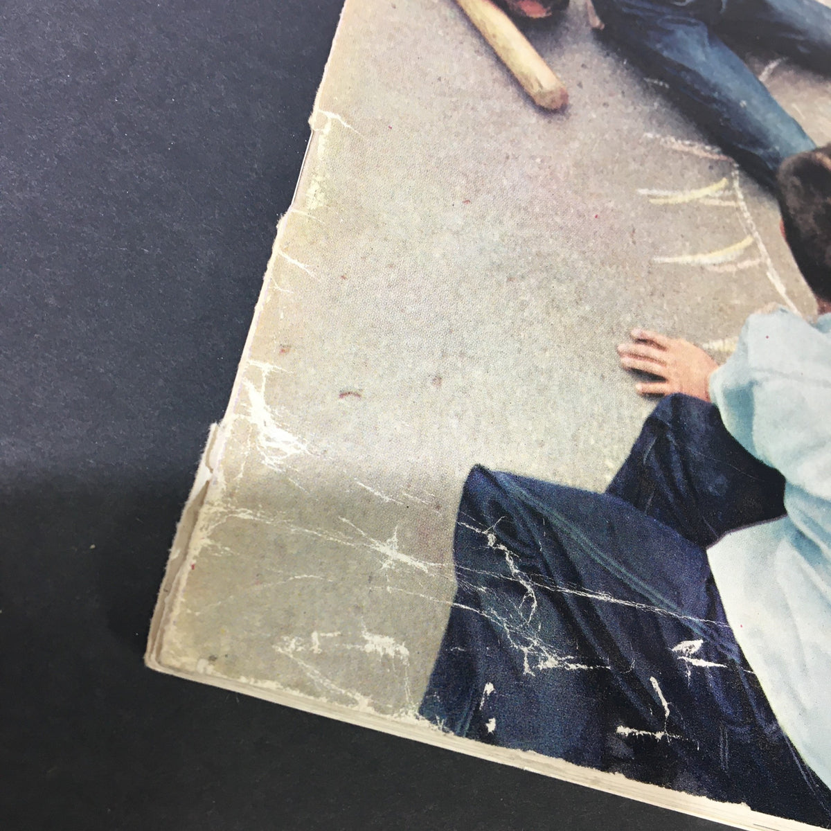 Close-up view of the worn edge of the VTG Better Movie Making September October 1960 magazine, showcasing minor damage that adds to its vintage character.