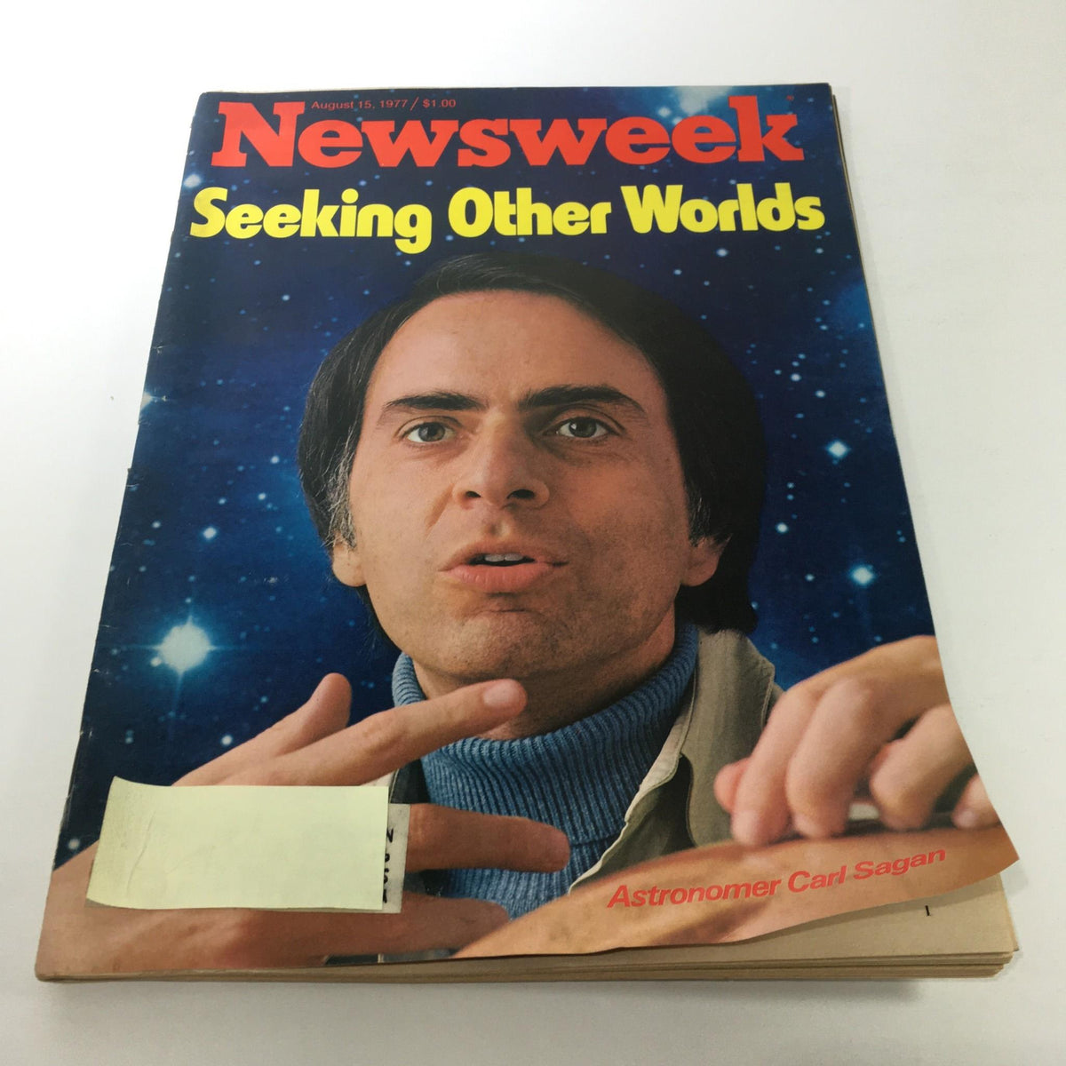 Newsweek Magazine cover from August 15, 1977, featuring astronomer Carl Sagan with the headline 'Seeking Other Worlds'. The cover highlights Sagan discussing humanity's quest for extraterrestrial life against a starry background.