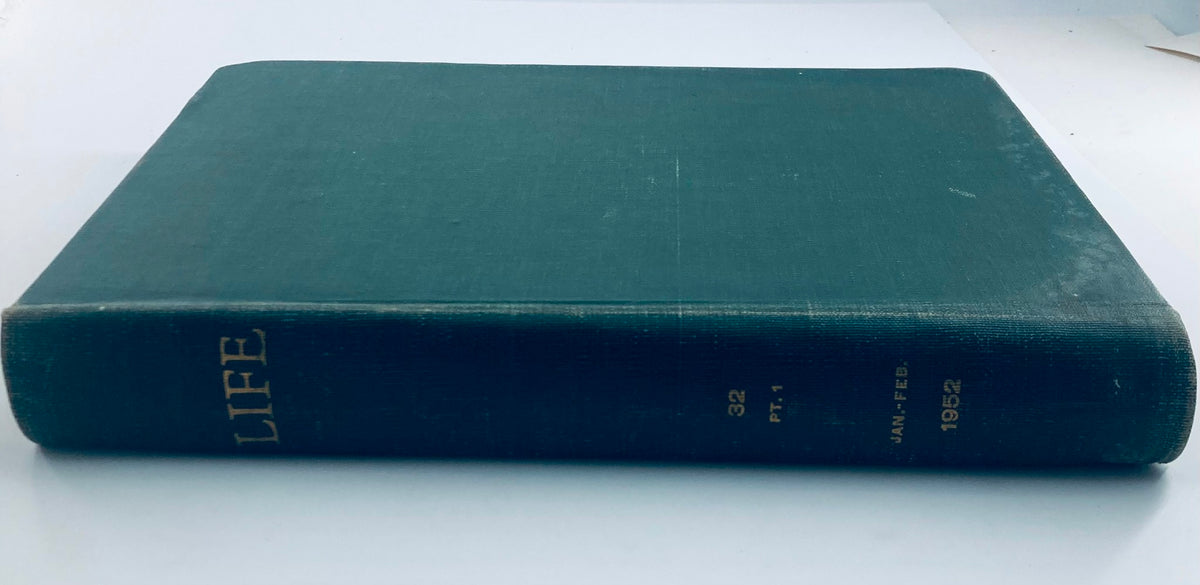 Side view of the 1952 bound Life Magazine collection, well-preserved and showcasing the title "LIFE" in gold lettering on the spine. A valuable addition to any library.