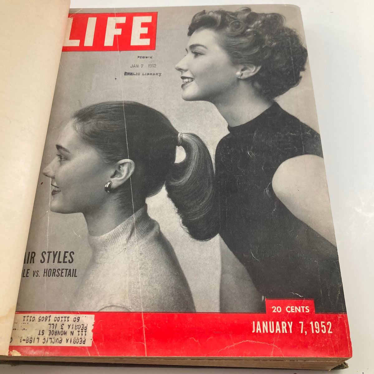 Front cover of the January 7, 1952 issue of Life Magazine, highlighting hair styles with an engaging image and featuring the title, part of the VTG 1952 Bound Life Magazine collection.