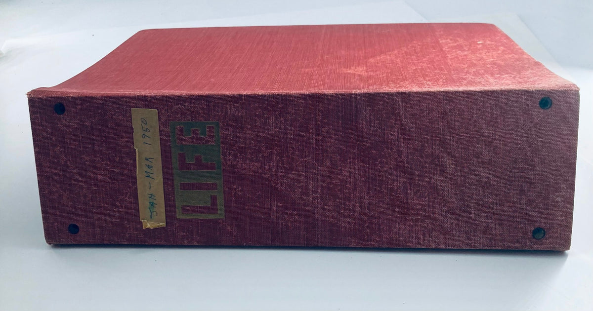 Bound collection of vintage LIFE magazines from 1950, showcasing the iconic red cover with the word 'LIFE' in large letters, highlighting its historical significance.