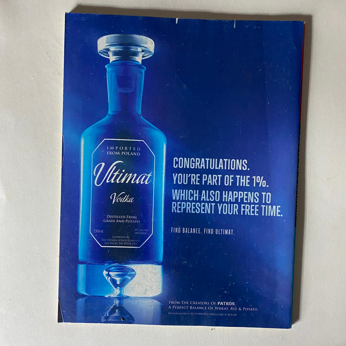 Advertisement from the back of Fortune Magazine September 3, 2012 promoting Ultimat Vodka, crafted from potatoes and grain, presented in a blue bottle, reflecting luxury and lifestyle.