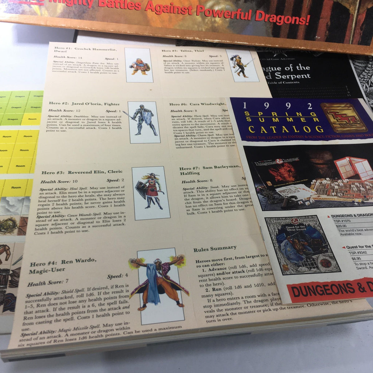 Hero character cards for TSR Board Game: Dungeons & Dragons Game The Dragon's Den, including abilities and health statistics for players.