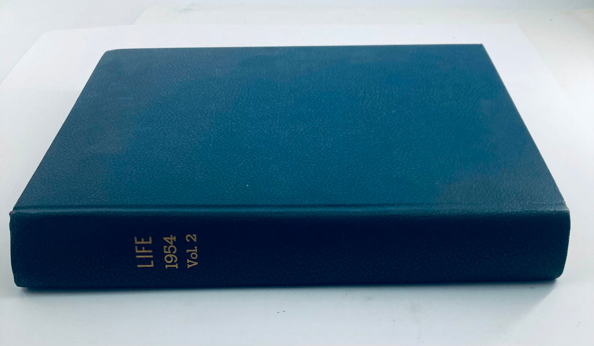 Vintage 1954 bound Life Magazine showcasing the cover of the year with 'LIFE 1954 Vol. 2' embossed in gold on the spine.