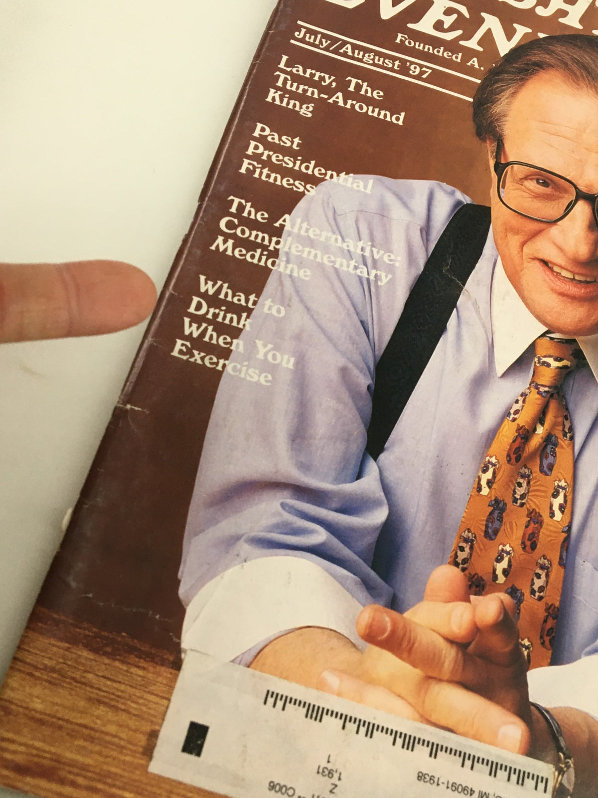 Close-up of the cover of The Saturday Evening Post July/August 1997 displaying 'Larry King: The Turn-Around King' headline. Larry King is shown with clasped hands, showcasing his engaging persona, characteristic of his interview style.